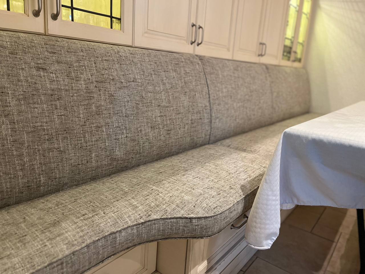 Custom dark green velvet curved sectional ottoman — bespoke furniture manufacturing Montreal by Atlas Upholstering