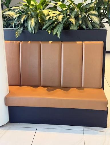 Caramel channel-tufted leather restaurant booth — commercial banquette Montreal by Atlas Upholstering