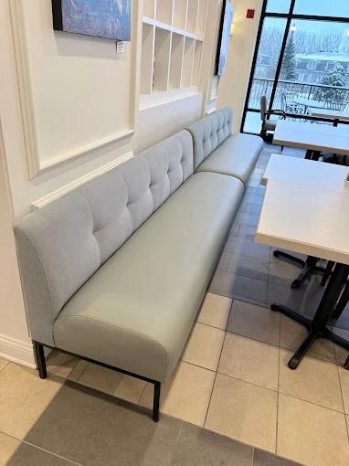 Grey tufted restaurant banquette — custom commercial upholstery Montreal by Atlas Upholstering